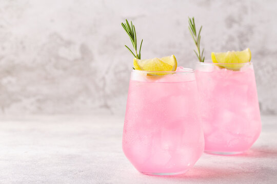 Refreshing pink drink or cocktail with ice