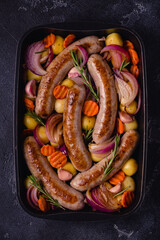 Fried sausages with vegetables.