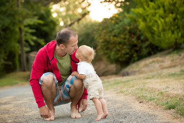 Fototapeta premium Portrait of happy father and his little son, son hugging his father, father's day concept