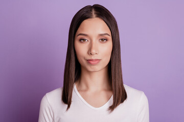 Fototapeta premium Photo of young serious attractive woman confident smart wear casual outfit isolated over violet color background