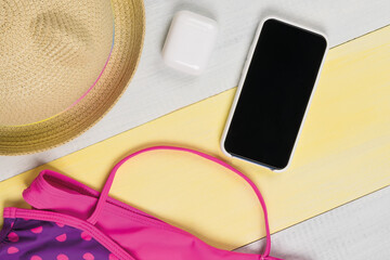womens beach set with phone and headphones for relaxation