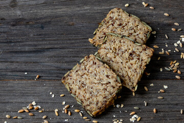 wholemeal bread in slices on wooden table