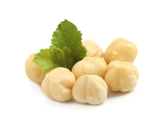 Tasty organic hazelnuts and leaves on white background
