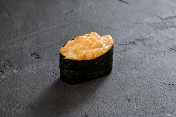 close up view of maki sushi roll on stone table