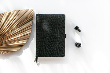 Black notebook on a flat lay for business and education