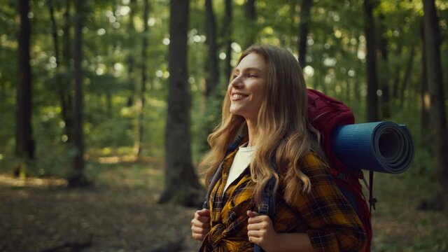 Close Up Portrait Of Cute Happy Active Woman Enjoying Beauty Of Nature, Backpacking With Equipment In Warm Autumn Forest