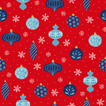 Seamless pattern of blue Christmas decoration and snowflakes on red background. Christmas tree decoration in different shapes.