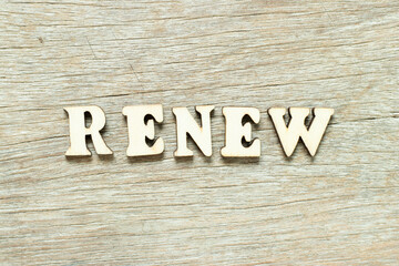 Alphabet letter in word renew on wood background