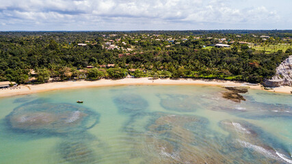 Praia de Curuípe, Porto Seguro, Bahia. Aerial view of Curuípe beach with reefs, corals and cliffs