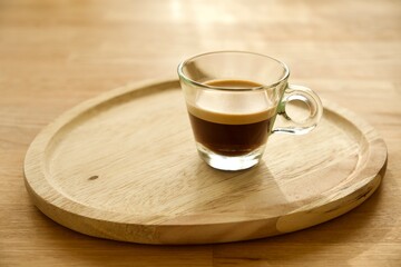 cup of coffee on wooden table