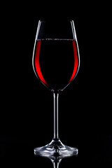 Glasses of wine on a black background.