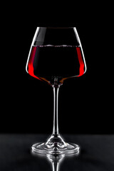 Glasses of wine on a black background.