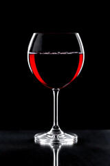 Glasses of wine on a black background.