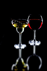 Glasses of wine on a black background.