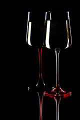 Glasses of wine on a black background.