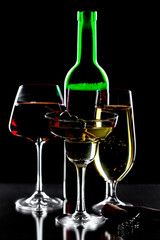 Glasses of wine on a black background.