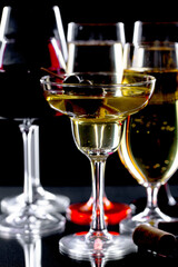 Glasses of wine on a black background.