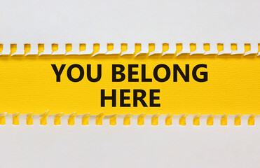 You belong here symbol. Yellow and white paper. Words 'you belong here'. Beautiful yellow...