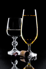 Glasses of wine on a black background.