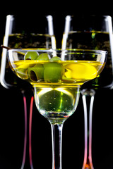 Glasses of wine on a black background.