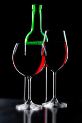 Glasses of wine on a black background.