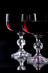 Glasses of wine on a black background.