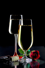 Glasses of wine on a black background.