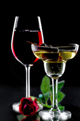 Glasses of wine on a black background.