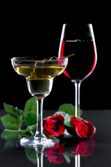 Glasses of wine on a black background.