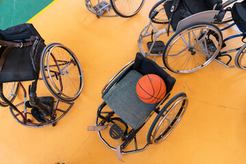 a photo of the wheelchair, wheelchair equipment and ball located in the arena before the game