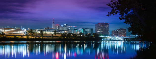 City of light night landscape in Hartford, Connecticut. Vibrant downtown lights reflected on the...