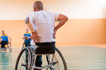 A player of the national basketball team is resting during the game in the big area. Selective focus 