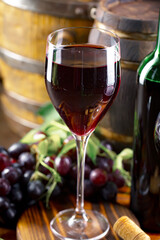 Wine in a glass on an old background