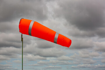 Windsock indicator of wind on tank chemical cone indicating wind direction and force. Horizontally...