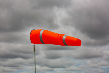 Windsock indicator of wind on tank chemical cone indicating wind direction and force. Horizontally...