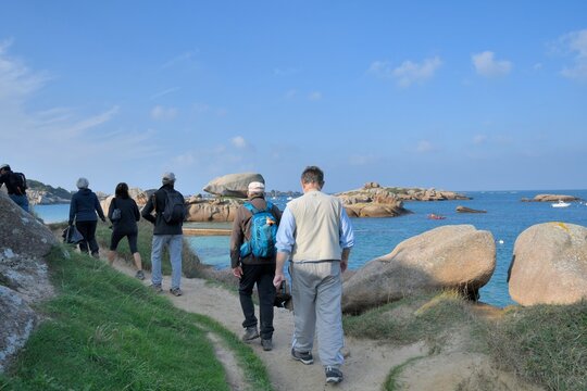 Senior hikers on a path in Brittany France