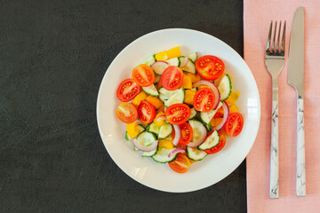 Green salad with tomato and fresh vegetables
