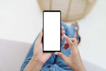 hand holding smartphone showing screen display above angle view