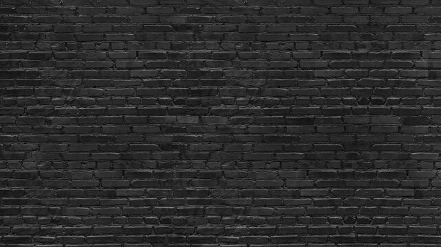 Old rough black brick wall large texture. Dark grey brickwork masonry backdrop. Gloomy grunge abstract background