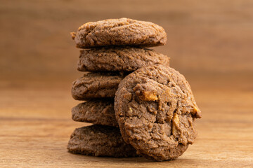 Stack of cookies on wooden table.
