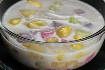 Sticky rice balls, ginkgo fruit and coconut meat in sweet coconut milk.