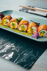 Japanese food photography, beautiful serving of sushi rolls, photography for restaurant menu