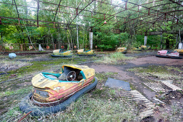Bumper cars at abandoned amusement park in Pripyat, Ukraine.  The city was abandoned due to the Chernobyl nuclear disaster.
