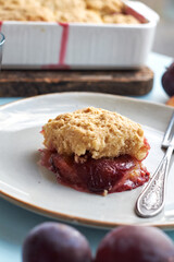 Plum cobbler on a blue background.