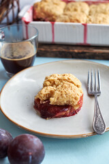Plum cobbler on a blue background.