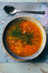 a traditional dish of Russian and Ukrainian cuisine, red borscht, with herbs and garlic