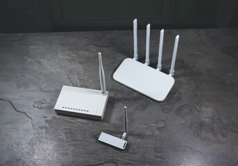 Three different types of Wi-Fi routers, modern and old technology. Wireless ethernet connection...