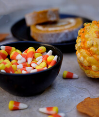 candy corn in a bowl with pumpkin bread 
