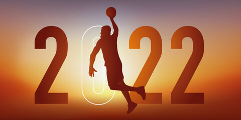 Concept du sport sur le thème du basket pour une carte de vœux 2022, montrant un basketteur sautant le bras tendu pour marquer un panier.