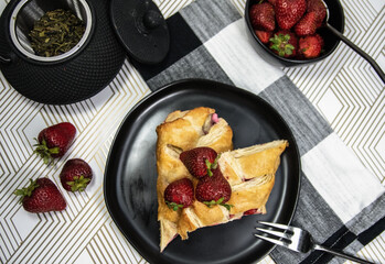 pastry  with strawberries with table setting 